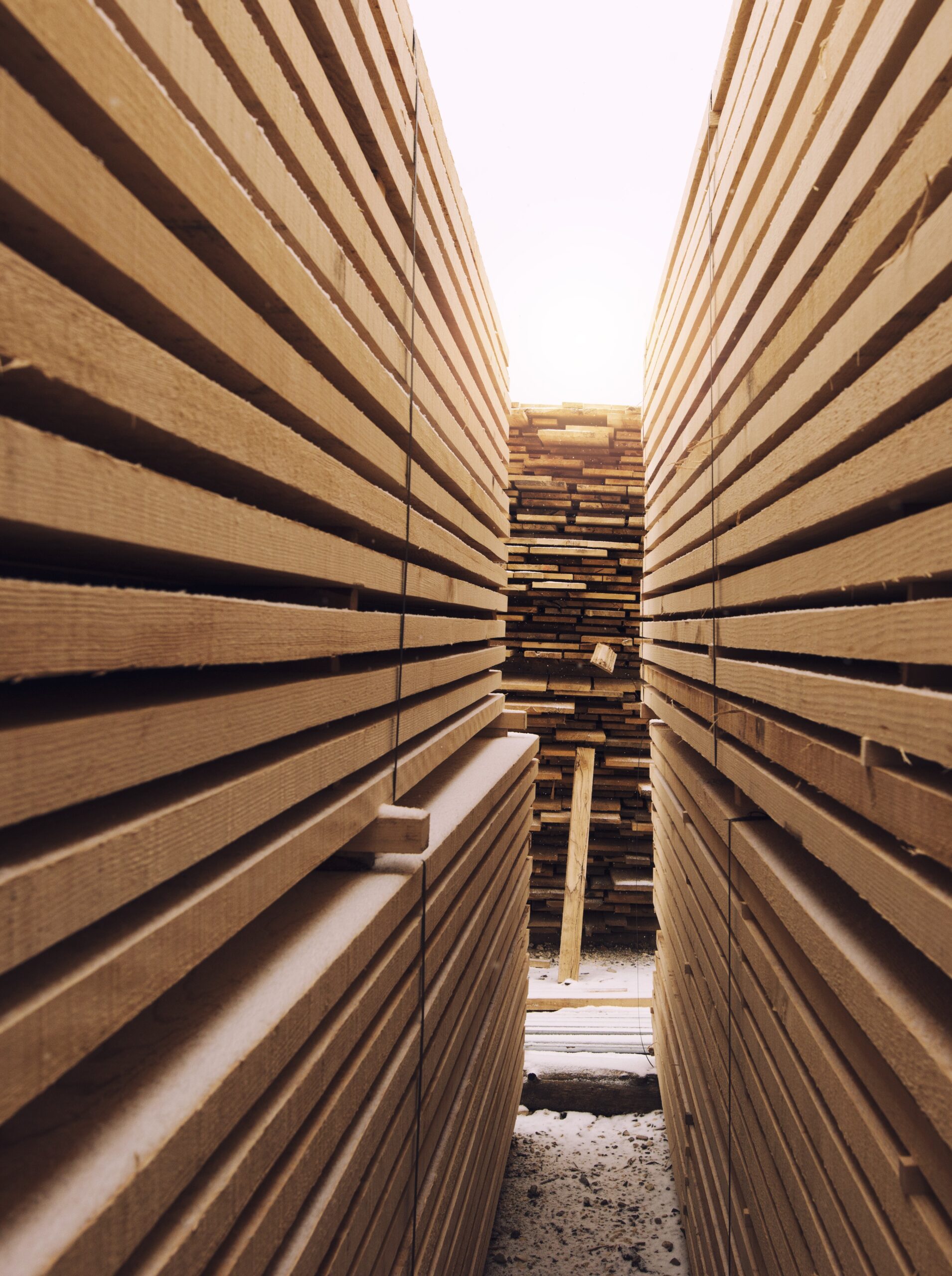 stack of wooden planks in sawmill lumber yard.
